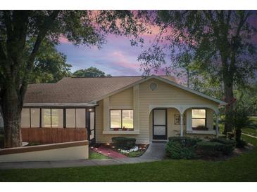 Charming single-story home featuring a well-manicured lawn and cozy front porch, perfect for relaxing evenings at 8158 Sturbridge Ct # D, Weeki Wachee, FL 34613
