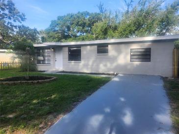 Charming single-story home with a well-maintained lawn and newly painted driveway at 9432 84Th St, Seminole, FL 33777