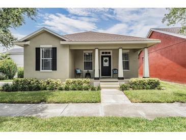 Charming single-story home with a welcoming front porch and well-maintained landscaping at 10115 Ringling St, New Port Richey, FL 34655