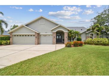 Charming single-story home featuring a three-car garage and well-manicured landscaping at 2519 Shipston Ave, New Port Richey, FL 34655