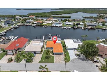 Waterfront home with private dock on canal with Gulf access and beautiful landscaping at 3701 Corsair Ct, New Port Richey, FL 34652