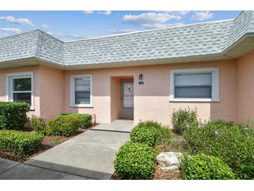 Cozy single story home exterior with tidy landscaping, a neutral color scheme, and a grey roof at 3745 Teeside Dr # 3745, New Port Richey, FL 34655