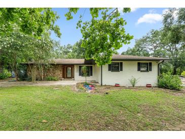 Charming single-story home featuring stone accents and a well-maintained front yard at 34955 Blanton Rd, Dade City, FL 33523