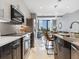 Modern kitchen with stainless steel appliances and an island at 1558 4Th St # 406, Sarasota, FL 34236