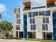 Modern building exterior with blue accents and wood details at 1558 4Th St # 406, Sarasota, FL 34236