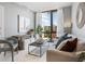 Modern living room with large window and stylish furniture at 1558 4Th St # 406, Sarasota, FL 34236