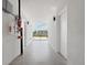 Bright hallway with tile floors and access to various rooms at 1558 4Th St # 406, Sarasota, FL 34236