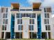 Modern building exterior with blue accents and wood details at 1558 4Th St # 406, Sarasota, FL 34236