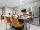 Modern kitchen with stainless steel appliances and an island at 1558 4Th St # 406, Sarasota, FL 34236
