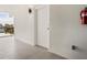 Private hallway with tiled floors and a fire extinguisher at 1558 4Th St # 406, Sarasota, FL 34236