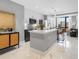 Open concept kitchen with marble flooring, center island, and modern cabinetry at 1558 4Th St # 406, Sarasota, FL 34236