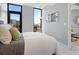 Spacious bedroom with large windows offering a city view, and a neutral color scheme at 1558 4Th St # 406, Sarasota, FL 34236