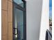 Private balcony with wood-like siding and modern black metal railing at 1558 4Th St # 406, Sarasota, FL 34236