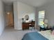 Bedroom with window and built-in desk at 593 Azure Rd, Venice, FL 34293