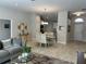 Bright dining room with glass table and view of kitchen at 593 Azure Rd, Venice, FL 34293