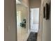 Hallway with light flooring, access to other rooms, and seating area at 593 Azure Rd, Venice, FL 34293