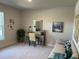 Bright home office features a desk, chair, and comfortable sofa at 593 Azure Rd, Venice, FL 34293