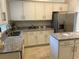 Modern kitchen with white cabinets and granite counters at 593 Azure Rd, Venice, FL 34293