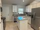 Modern kitchen with stainless steel appliances and granite countertops at 593 Azure Rd, Venice, FL 34293