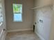 Laundry room with tile floor, shelving and hookups at 593 Azure Rd, Venice, FL 34293
