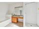 Bathroom featuring a vanity, shower and large soaking tub at 2781 Shady Ave, North Port, FL 34286
