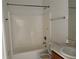 Bathroom featuring a shower-tub combo and a single sink vanity with a tile countertop at 2781 Shady Ave, North Port, FL 34286
