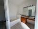 Bathroom featuring a vanity, mirror, tub, and tile floor at 2781 Shady Ave, North Port, FL 34286