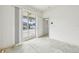 Bedroom with an open door to the yard and view of the outdoor swimming pool at 2781 Shady Ave, North Port, FL 34286