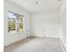 Spacious bedroom with window overlooking the street, ready for customization at 2781 Shady Ave, North Port, FL 34286