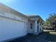 Home exterior featuring a spacious garage and traditional design elements, offering comfort and style at 2781 Shady Ave, North Port, FL 34286