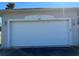 Garage door on home with visible house number in a neutral color palette at 2781 Shady Ave, North Port, FL 34286