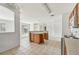 An island kitchen featuring a sink and outdated cabinets at 2781 Shady Ave, North Port, FL 34286