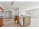 An open-concept kitchen with outdated appliances and fixtures at 2781 Shady Ave, North Port, FL 34286
