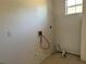 Unfinished laundry room featuring hookups, tile flooring, and a single window at 2781 Shady Ave, North Port, FL 34286