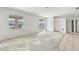 Large living room with a window and sliding glass door at 2781 Shady Ave, North Port, FL 34286