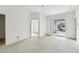 Spacious main bedroom with concrete floors and sliding doors to the backyard at 2781 Shady Ave, North Port, FL 34286