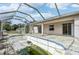Wide angle view of the screened-in pool highlighting its size and layout in the backyard at 2781 Shady Ave, North Port, FL 34286