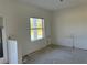 Spacious spare bedroom with large window at 2781 Shady Ave, North Port, FL 34286