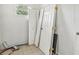 Storage area with tile floors, a window and several doors leaning against the wall at 2781 Shady Ave, North Port, FL 34286