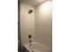 Modern bathroom with shower and tub featuring textured, wavy tile design for a luxurious feel at 310 Day Break Cir, Port Charlotte, FL 33954
