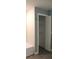 Compact bathroom closet with shelving for organized storage and easy accessibility at 310 Day Break Cir, Port Charlotte, FL 33954