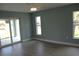 Bedroom featuring a ceiling fan and access to a sliding glass door with abundant natural light at 310 Day Break Cir, Port Charlotte, FL 33954