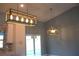 Stylish kitchen boasts modern pendant lighting and easy access to outdoor spaces at 310 Day Break Cir, Port Charlotte, FL 33954