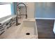 Modern kitchen sink with stylish faucet and white marble countertops with gray backsplash at 310 Day Break Cir, Port Charlotte, FL 33954