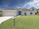 Single-story home with attached garage and manicured lawn at 1139 Euclid Rd, Venice, FL 34293