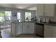 Modern kitchen with granite countertops and stainless steel appliances at 1139 Euclid Rd, Venice, FL 34293