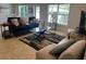 Spacious living room with ample natural light and stylish furniture at 1139 Euclid Rd, Venice, FL 34293