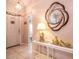 Entryway with console table, mirror, and access to living spaces at 4450 47Th W Ave # 202, Bradenton, FL 34210