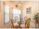Cozy breakfast nook with glass table and wicker chairs at 4450 47Th W Ave # 202, Bradenton, FL 34210