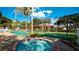 Community hot tub with lounge chairs and tennis courts nearby at 4450 47Th W Ave # 202, Bradenton, FL 34210